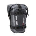 A black and gray SW MOTECH Drybag with reflective details and straps for attachment to a motorcycle.