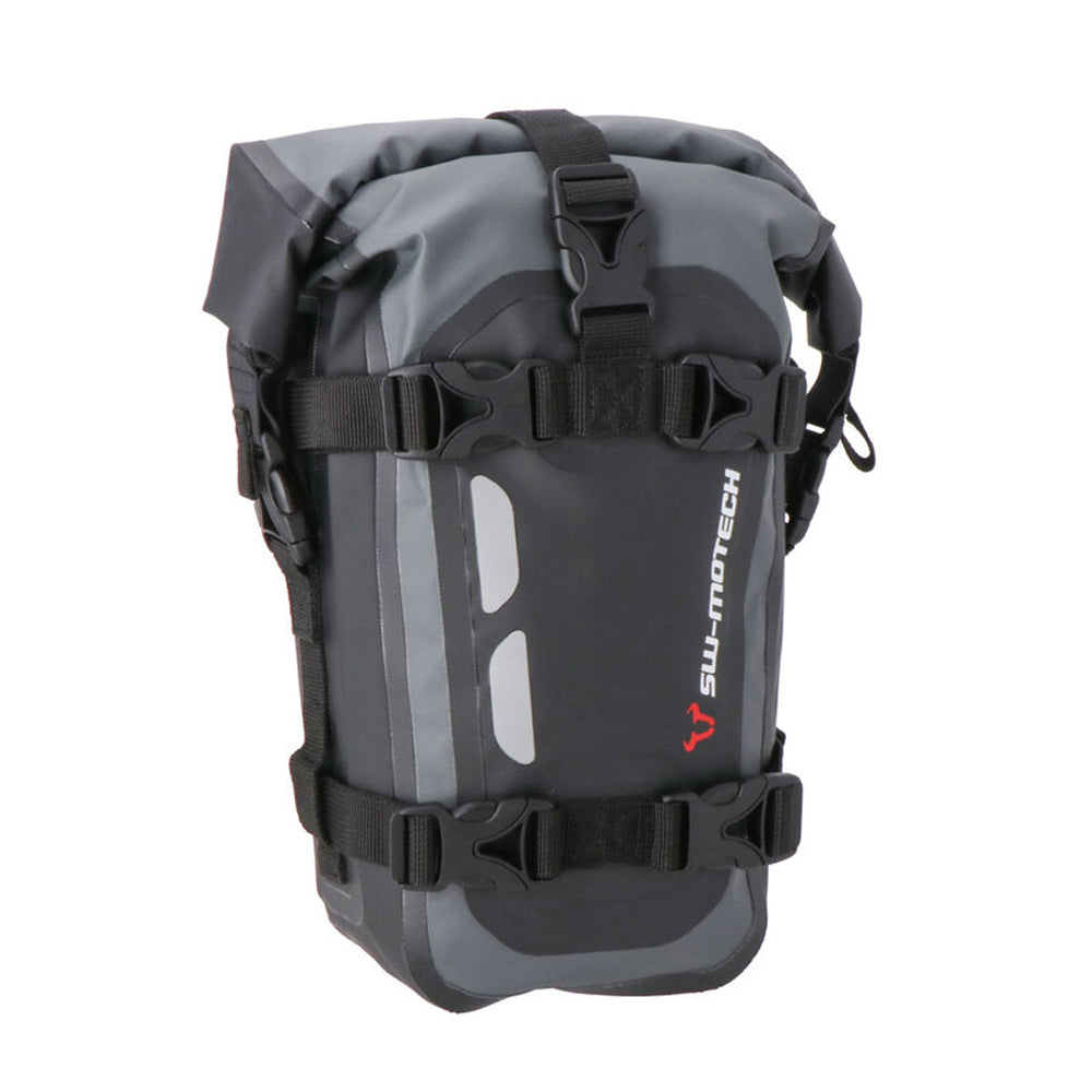 A black and gray SW MOTECH Drybag with reflective details and straps for attachment to a motorcycle.